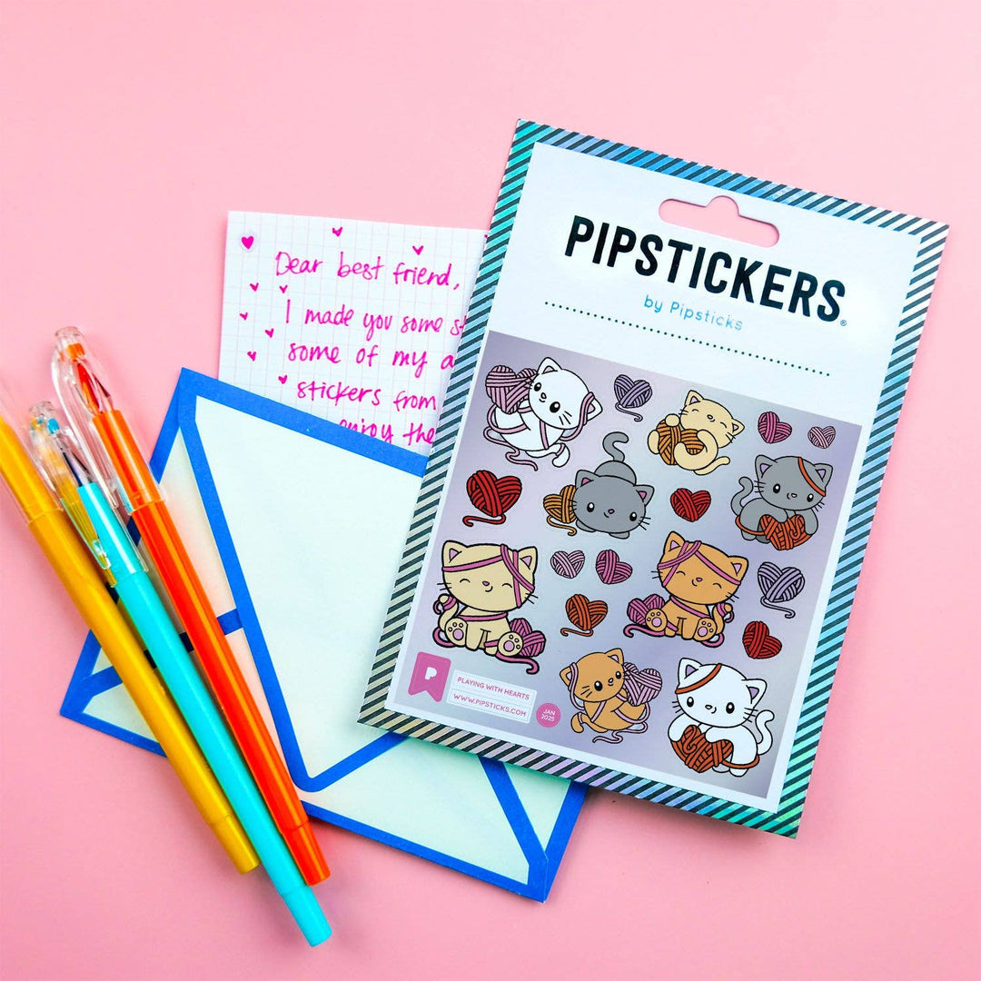 Pack of Pipsticks stickers with colorful pens and paper on a pink background