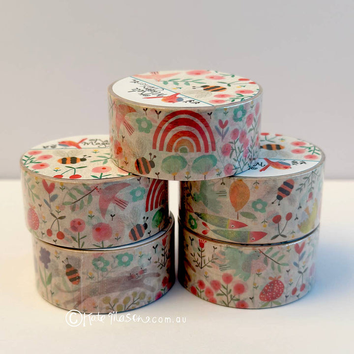 Set of colorful washi tape rolls with floral and rainbow designs on a white background.