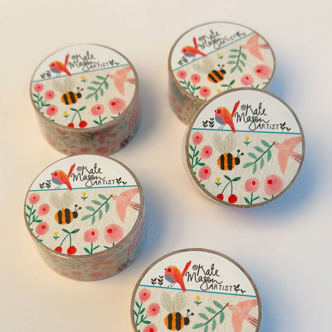 Five washi tapes with floral and nature-themed labels on a light background