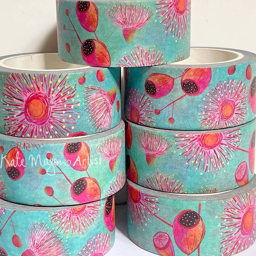 Stack of washi tape with floral design on a white background