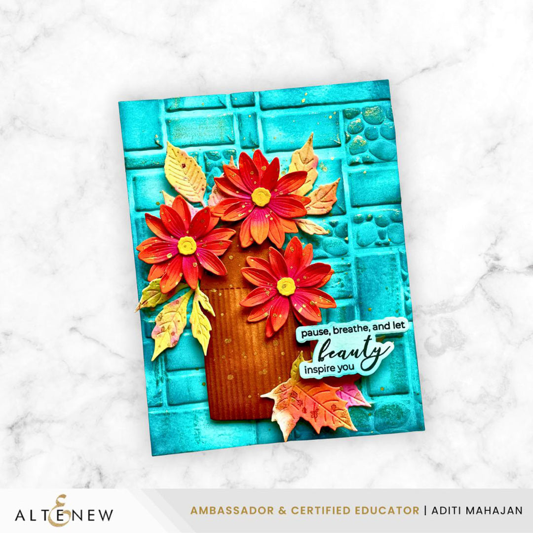 Colorful floral card with textured background and 'pause, breathe, and let beauty inspire you' text on a marble surface.