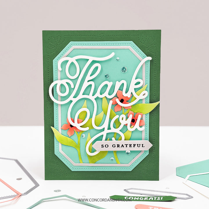 A card made with the Concord & 9th Essential Labels & Frames Dies: a large white 'Thank You' with coral flowers on a mint label and a 'so grateful' tag.