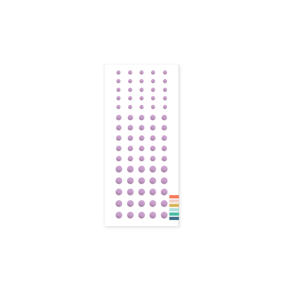 Sheet of purple polka dot stickers on a white background