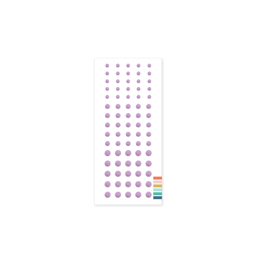 Sheet of purple polka dot stickers on a white background