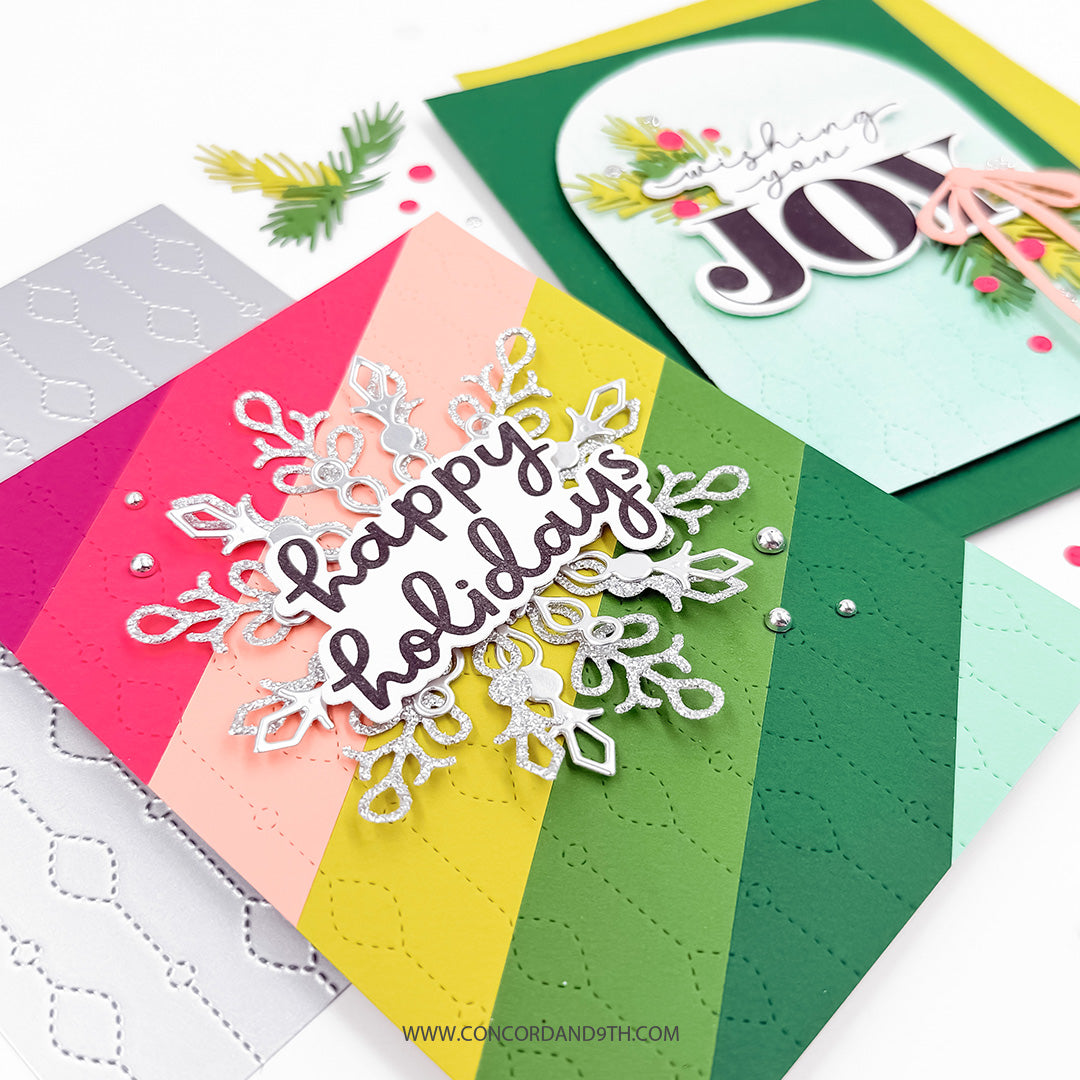 Concord & 9th Chandelier Card Front Die — two finished cards, the rainbow-striped snowflake card and the mint arch "Wishing You Joy" card, shown together.