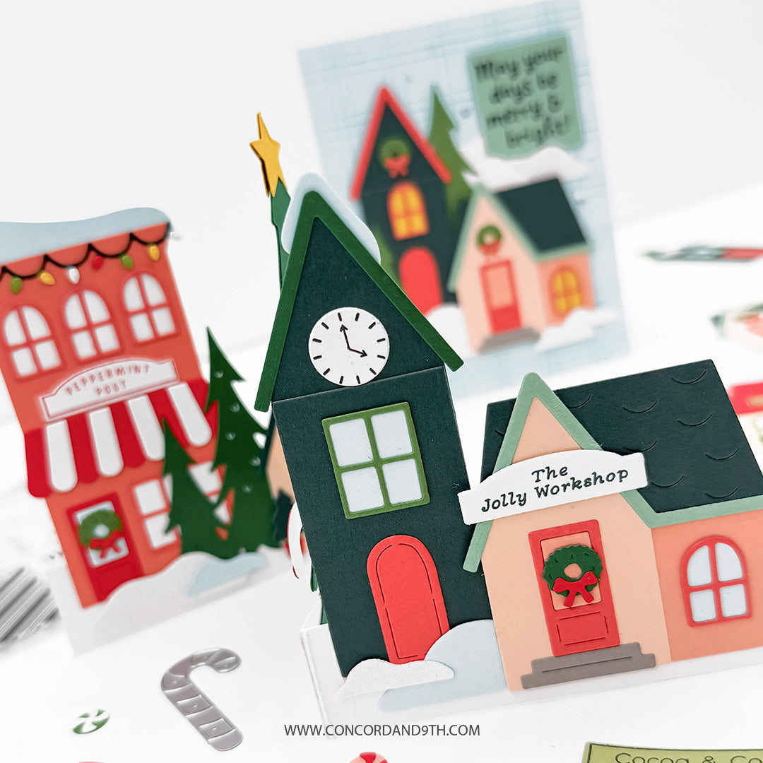 Concord & 9th North Pole Greetings Dies — two finished cards, the dimensional village row and the plaid cottage card, shown together.