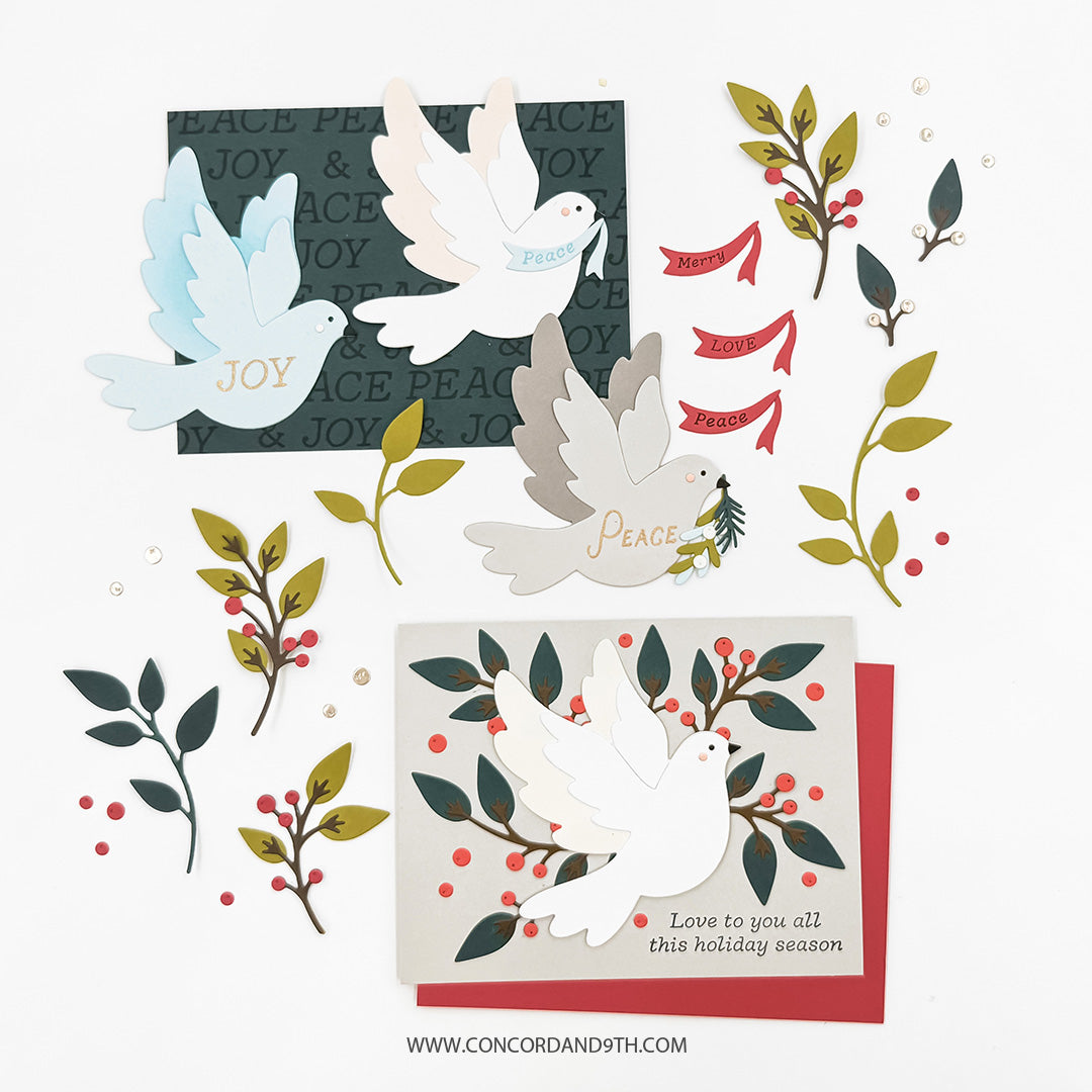 Concord & 9th Peaceful Dove Dies — colour variations of the dove in blue "JOY," peach, and grey "peace," plus a card pairing the dove with red berry branches and "Love to you all this holiday season."