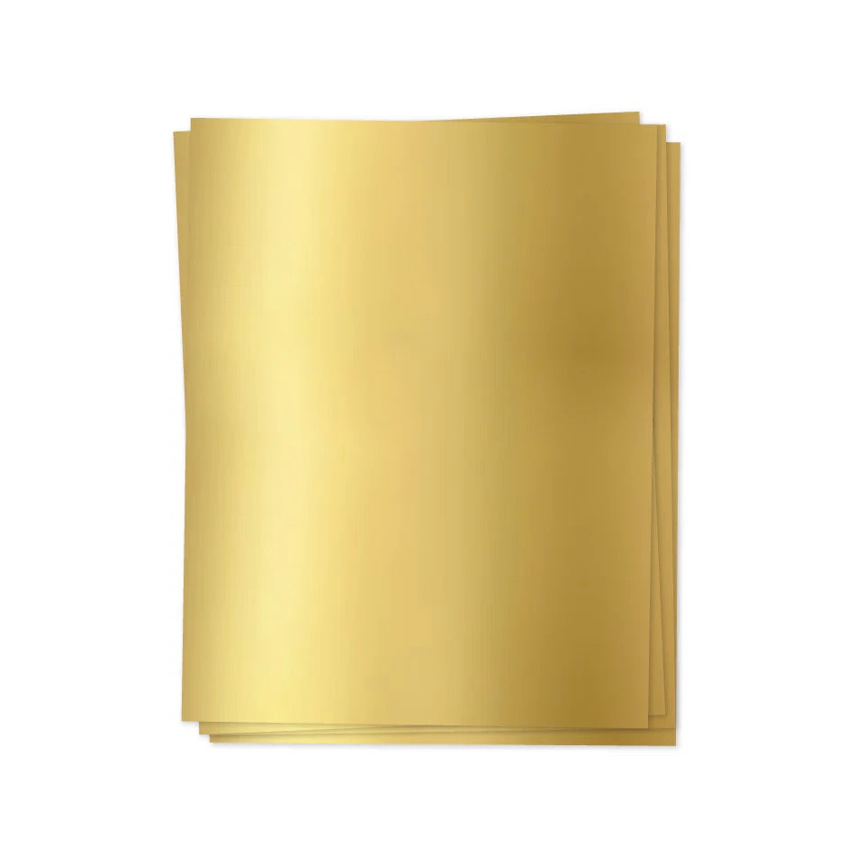 Stack of gold sheets on a white background