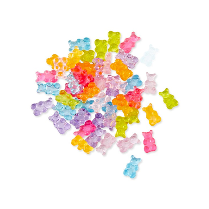 Colorful gummy bear candy embellishments on a white background