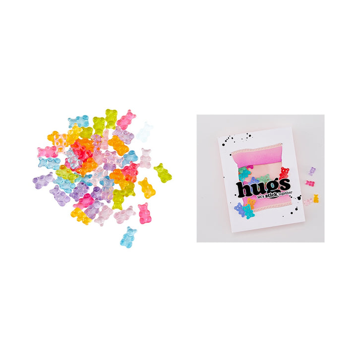 Colorful gummy bear-shaped embellishments with a card that says 'hugs' on a white background.