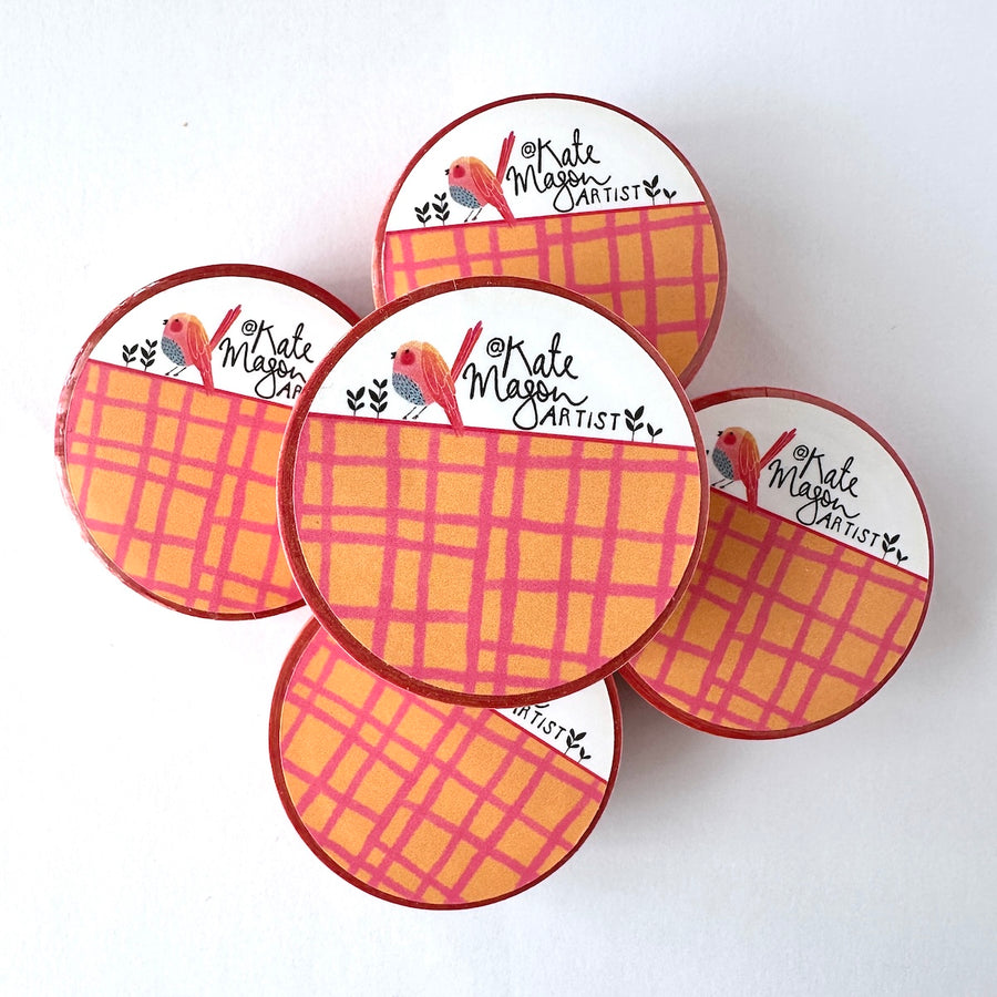 Five Washi tapes with a pink and orange plaid pattern and a white logo section featuring a small bird illustration and the text 'Kate Morgan Artist', arranged on a plain white background.