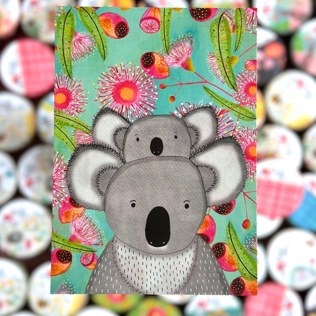 Illustration of two koalas on a colorful floral background with a blurred patterned background.