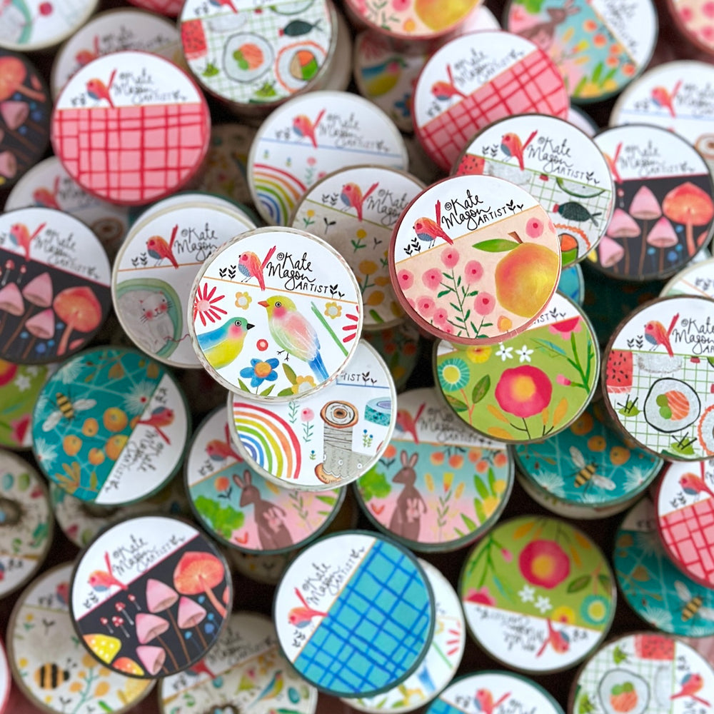 Collection of colorful washi tapes with various designs and text by Kate Mason art