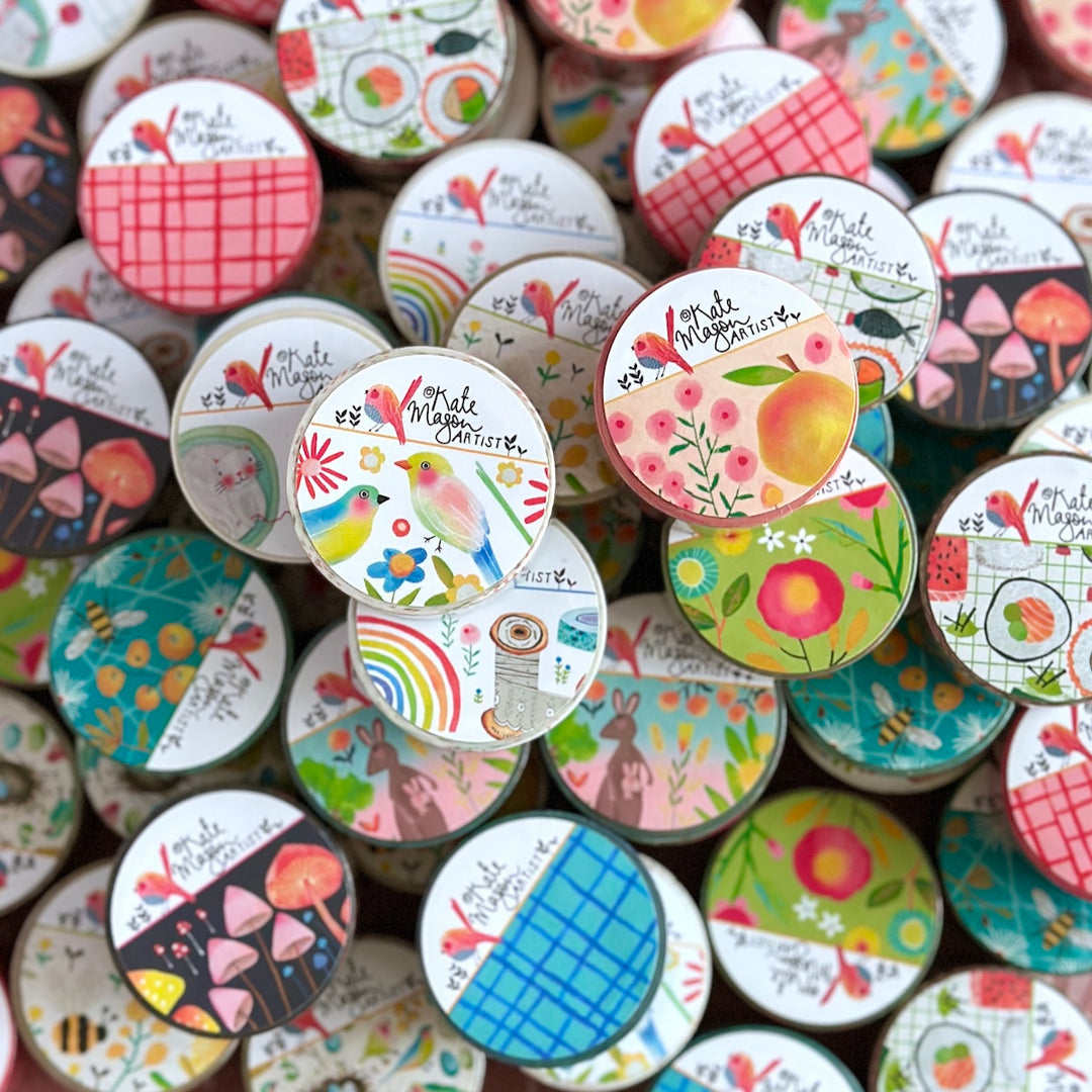 Collection of colorful washi tapes with various designs and text by Kate Mason art