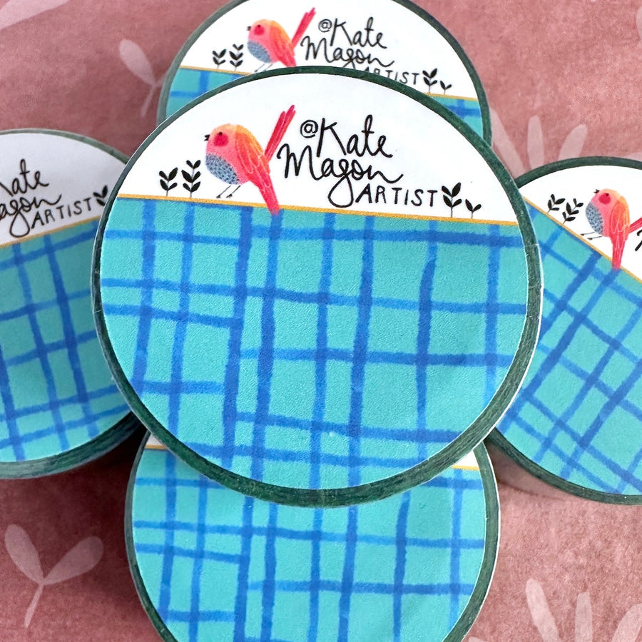 blue grid washi tape stack on pink background by Kate Mason art