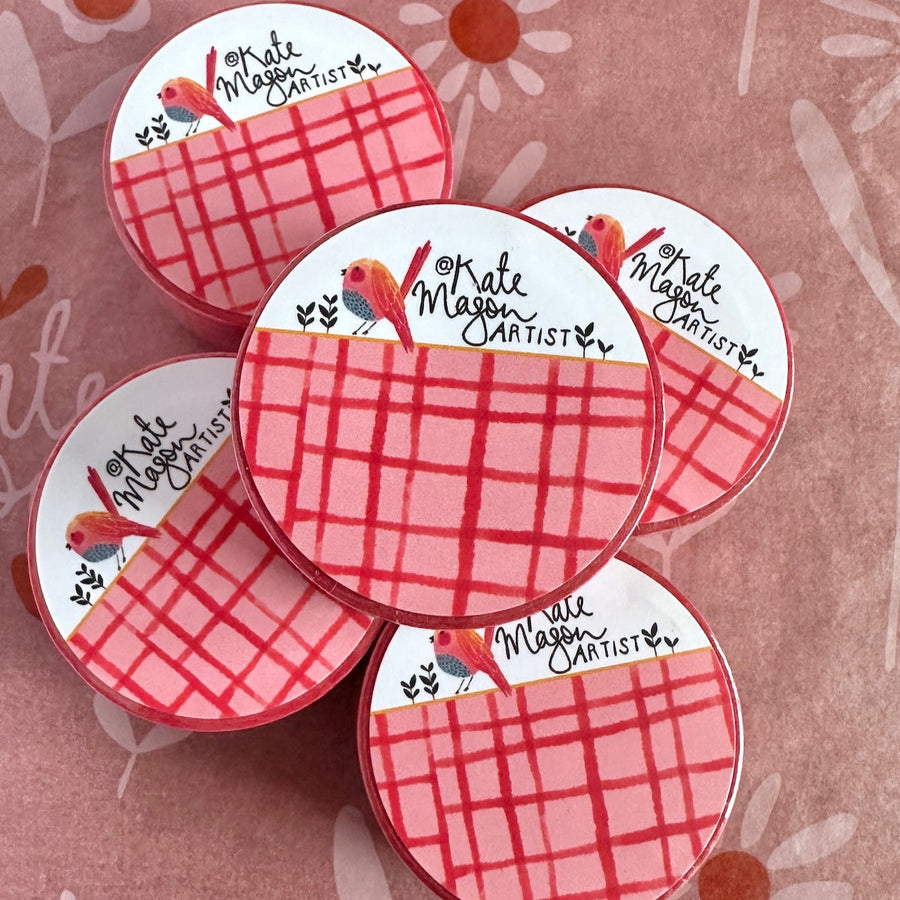 pile of red grid washi tapes by Kate Mason  art on a pink background