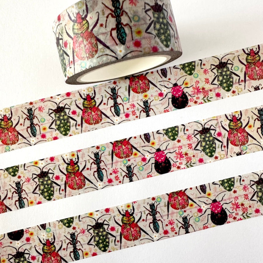 Decorative washi tape with beetle pattern on a white background