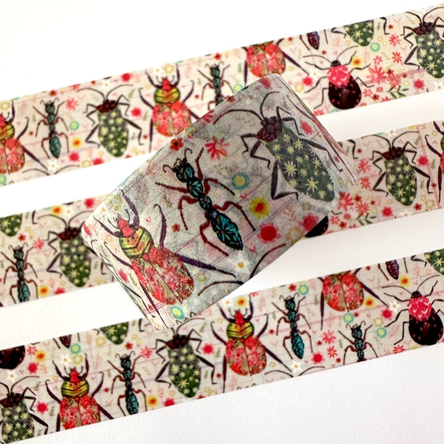 Decorative washi tape with colorful insect designs on a white background