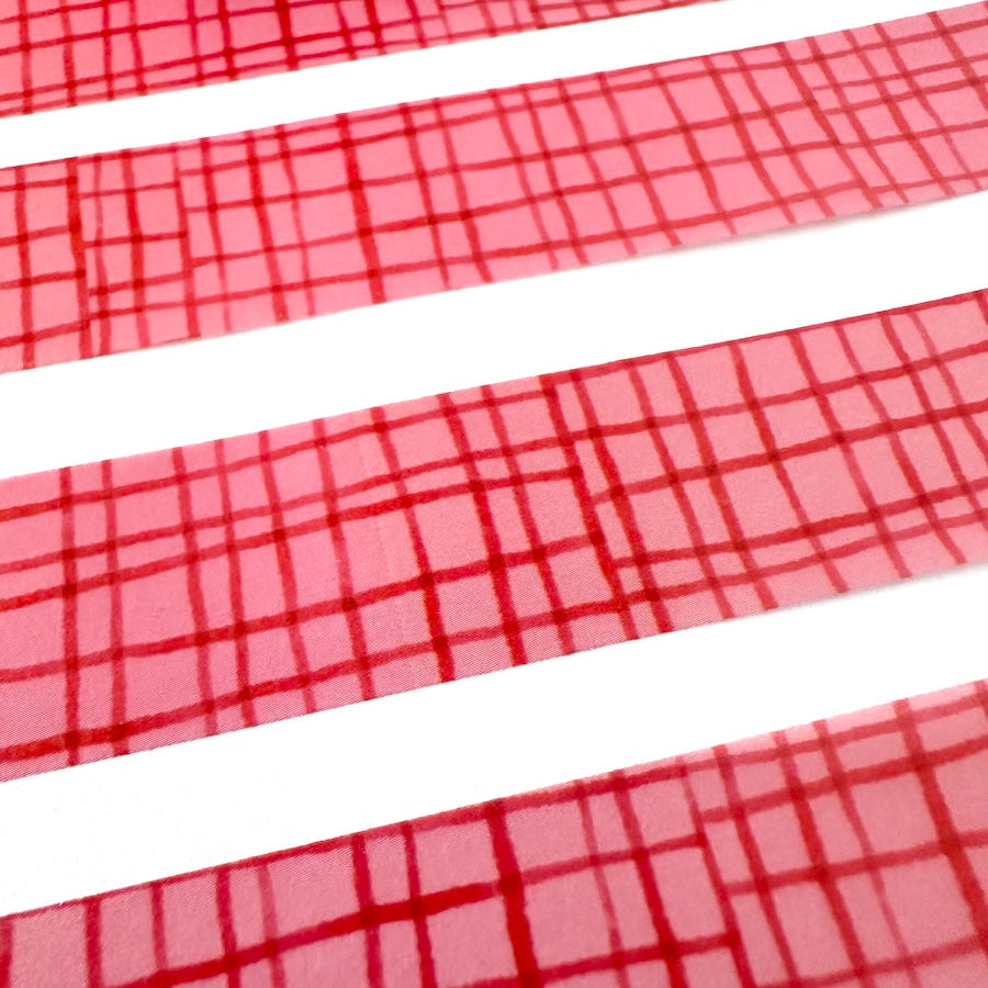 pink with red graph patterned washi tape on white background