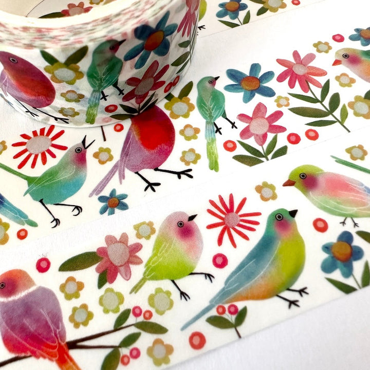 Decorative tape with colorful bird and flower design on a white background