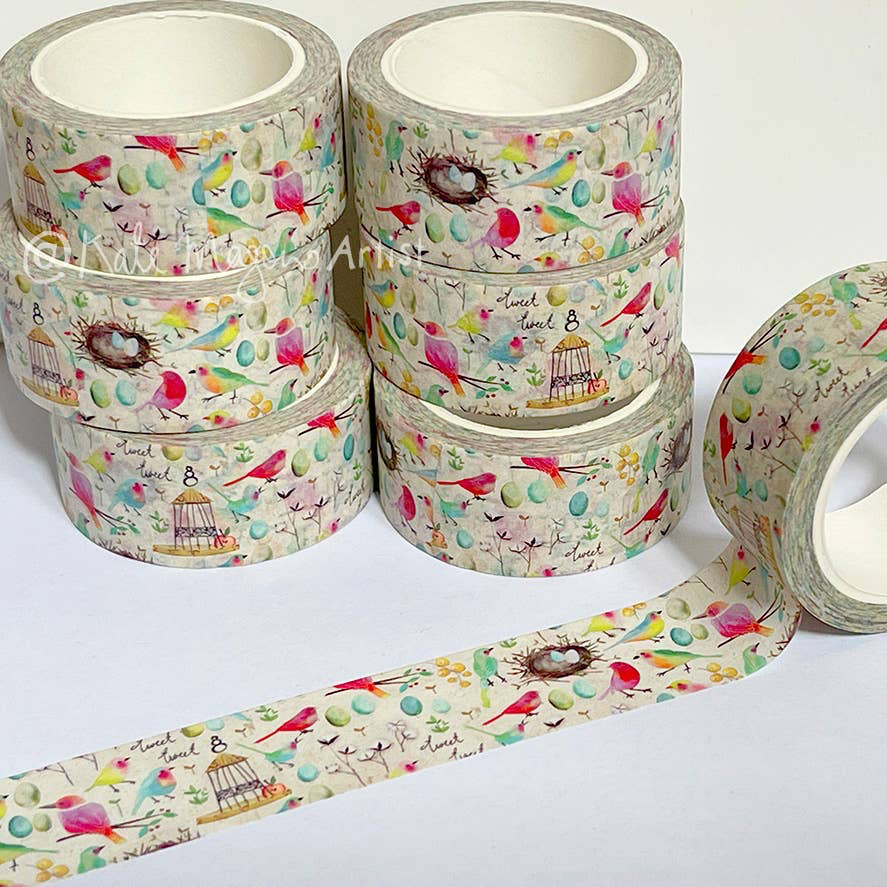 Set of decorative tape rolls with bird and nature patterns on a white background
