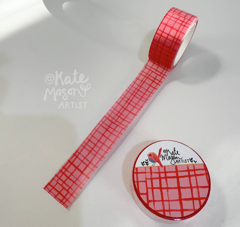 Red grid-patterned tape with a circular sticker featuring 'Kate Mason Artist' on a white background