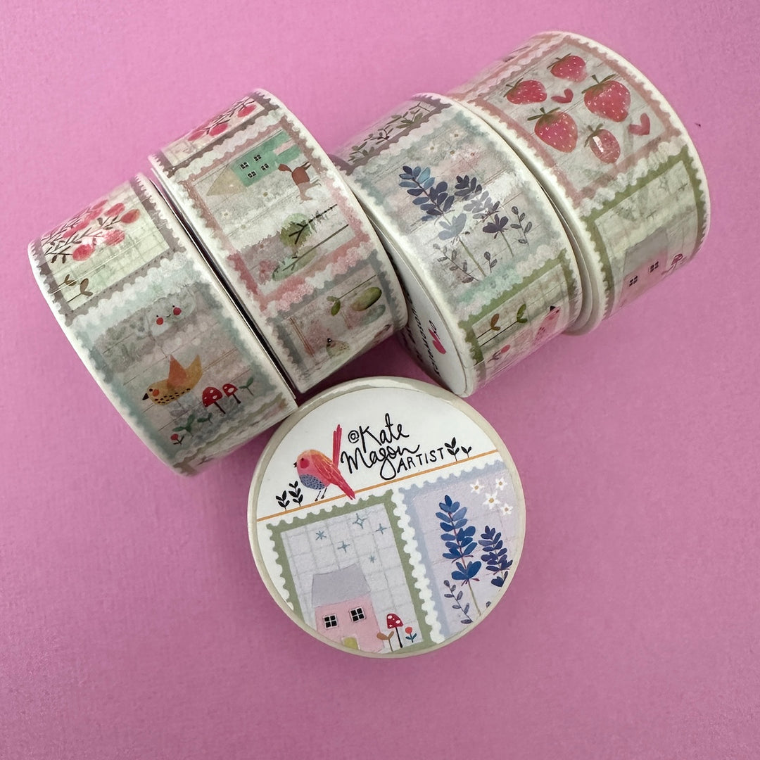 FIve rolls of decorative washi tape with nature patterns, arranged on a solid pink background with the label kate mason artist
