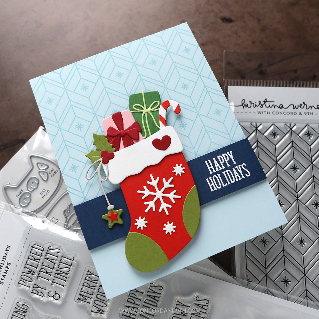 A card made with Kristina Werner's Happy Pawlidays Stamp Set: a red snowflake stocking full of presents on a pale blue background, with 'Happy Holidays'.