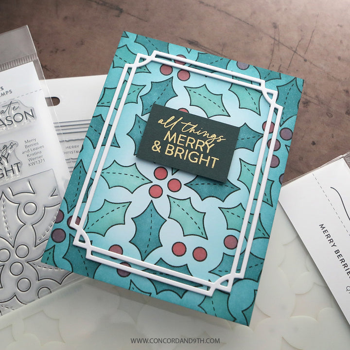 A card made with Kristina Werner's Merry Berries and Leaves Dies: a teal holly and berry background with a white double frame and 'all things merry & bright'.