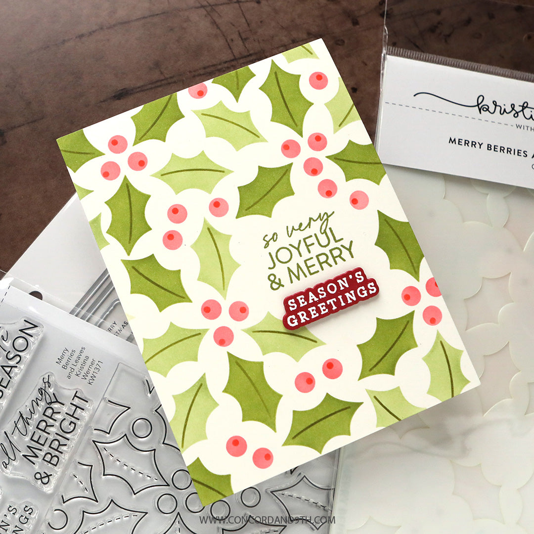 A card made with Kristina Werner's Merry Berries and Leaves Dies: a green holly and pink berry pattern with 'so very joyful & merry' and 'Season's Greetings'.