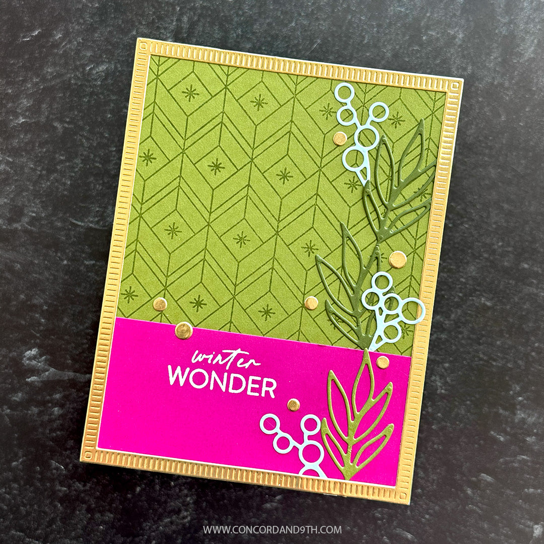 A card made with Kristina Werner's Poinsettia Inlay Dies: leafy branches and berries on a lime green and magenta background with 'winter wonder'.