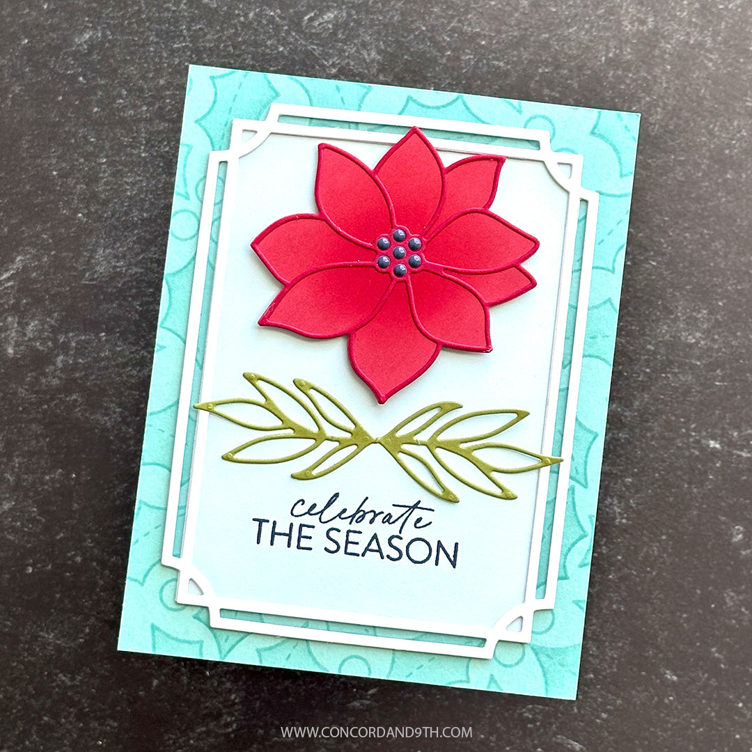 A card made with Kristina Werner's Poinsettia Inlay Dies: a pink poinsettia and leaf sprig with 'celebrate the season' in a white frame on aqua holly.
