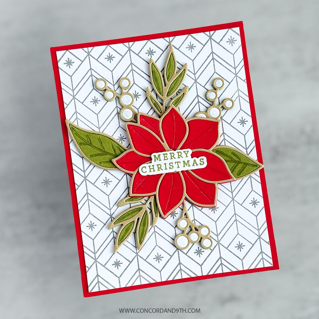 A card made with Kristina Werner's Poinsettia Inlay Dies: a layered red poinsettia with leaves, berries and 'Merry Christmas' on a silver patterned background.
