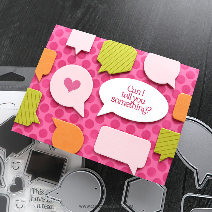 Decorative card with speech bubbles and cut-out shapes on a dark surface