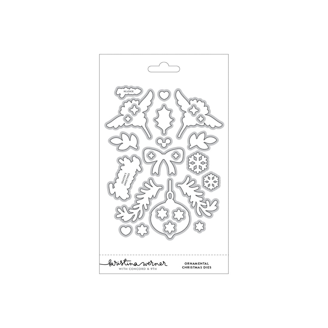 Concord & 9th Kristina Werner Ornamental Christmas Dies — angel wing, holly, bow, ornament, and snowflake dies with "Rejoice" and "Season's Greetings" word dies.