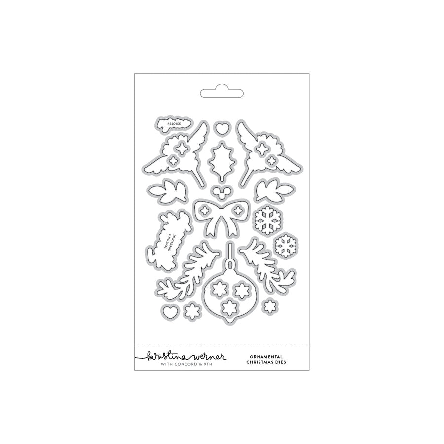 Concord & 9th Kristina Werner Ornamental Christmas Dies — angel wing, holly, bow, ornament, and snowflake dies with "Rejoice" and "Season's Greetings" word dies.