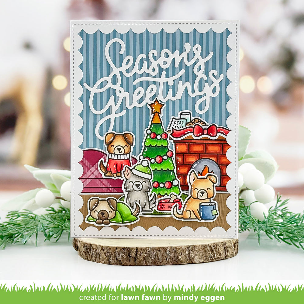 Lawn Fawn Cozy Dogs Season's Greetings card with puppies by a Christmas tree and brick fireplace, by Mindy Eggen