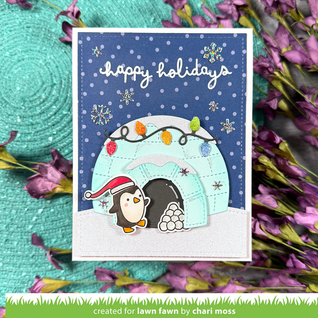 Lawn Fawn Build-An-Igloo Happy Holidays card with a penguin in an igloo under a starry night sky, by Chari Moss