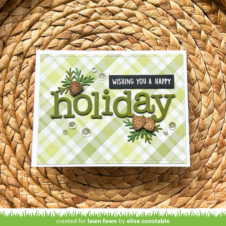 Lawn Fawn Charlie's ABCs Happy Holiday card with die cut letters and pinecones on green plaid, by Elise Constable