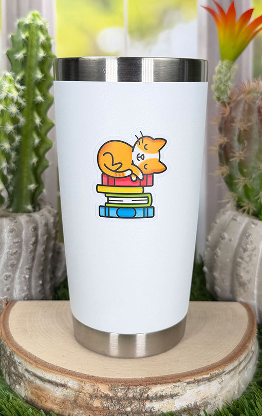 Lawn Fawn Book Stack Vinyl Sticker on a white drink tumbler