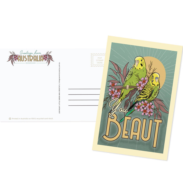 Postcard with parrot illustration and 'You Beaut' text on a white background