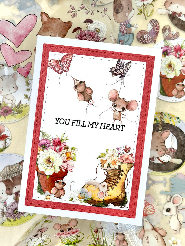 Card with cartoon mice from squeaky mischief tape and flowers on a patterned background