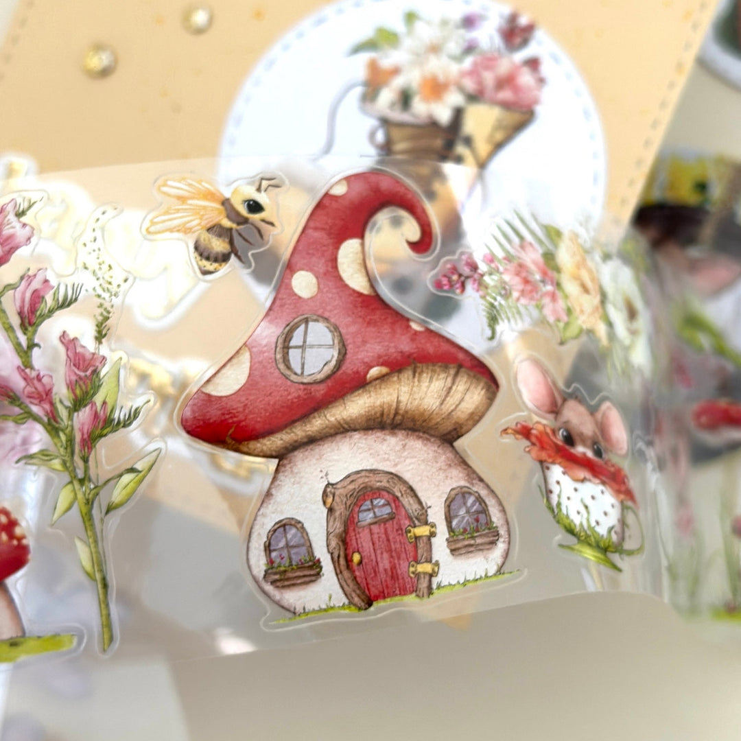 Decorative sticker with a mushroom house design on a clear background