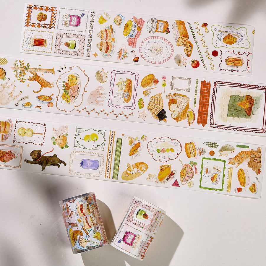 Strips of The Washi Tape Shop Autumn Pantry Wide Washi/PET Tape laid flat with the rolls, showing the full design