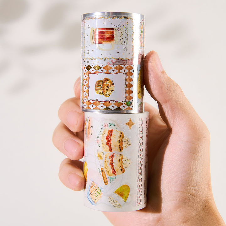 Hand holding the washi and PET rolls of The Washi Tape Shop Autumn Pantry Wide Washi/PET Tape