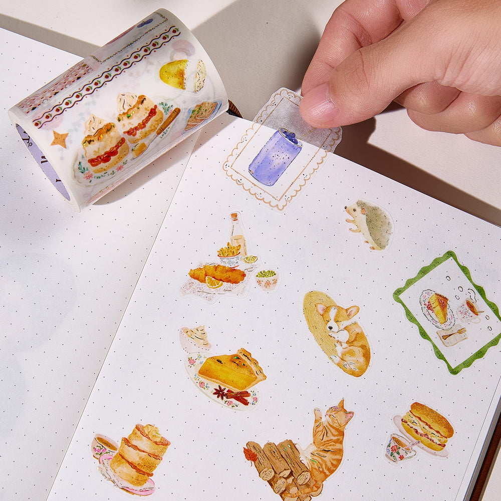 Hand peeling a pre-cut piece from The Washi Tape Shop Autumn Pantry Wide Washi/PET Tape onto a journal page