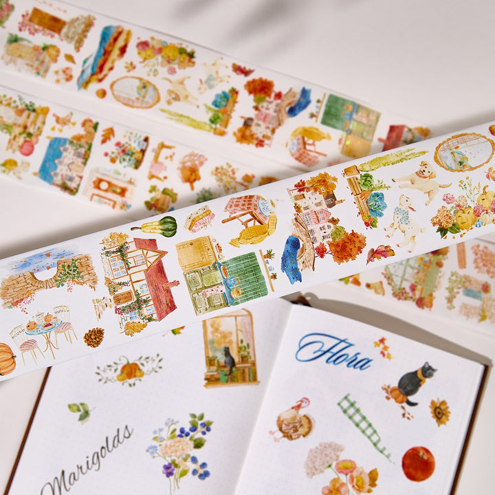 The Washi Tape Shop Autumn Village Wide Washi/PET Tape strips and peeled pieces arranged on a white page