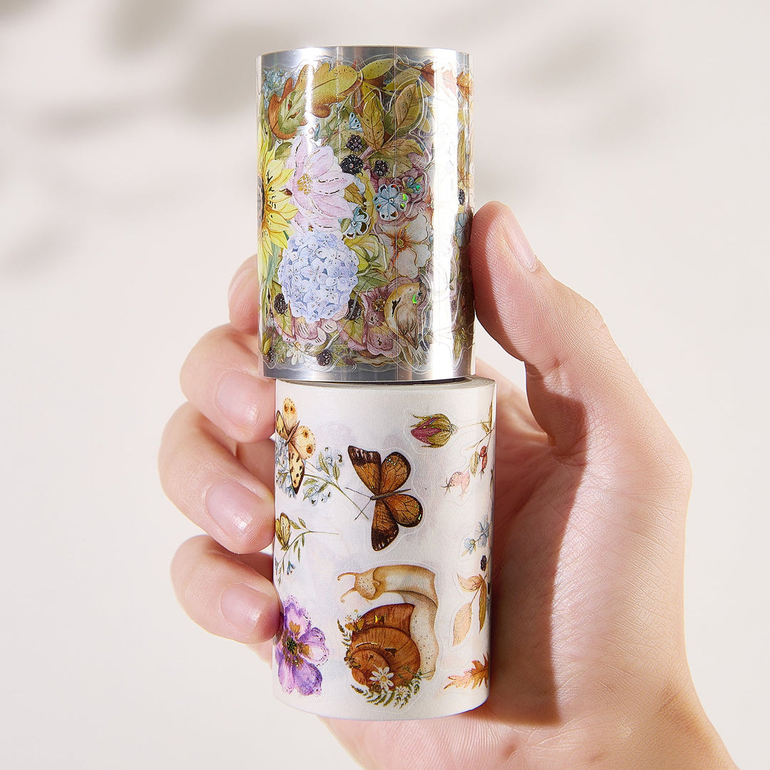 Hand holding both rolls of The Washi Tape Shop Golden Harvest Wide Washi/PET Tape