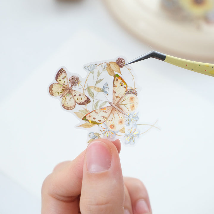 Tweezers lifting a pre-cut piece from The Washi Tape Shop Golden Harvest Wide Washi/PET Tape