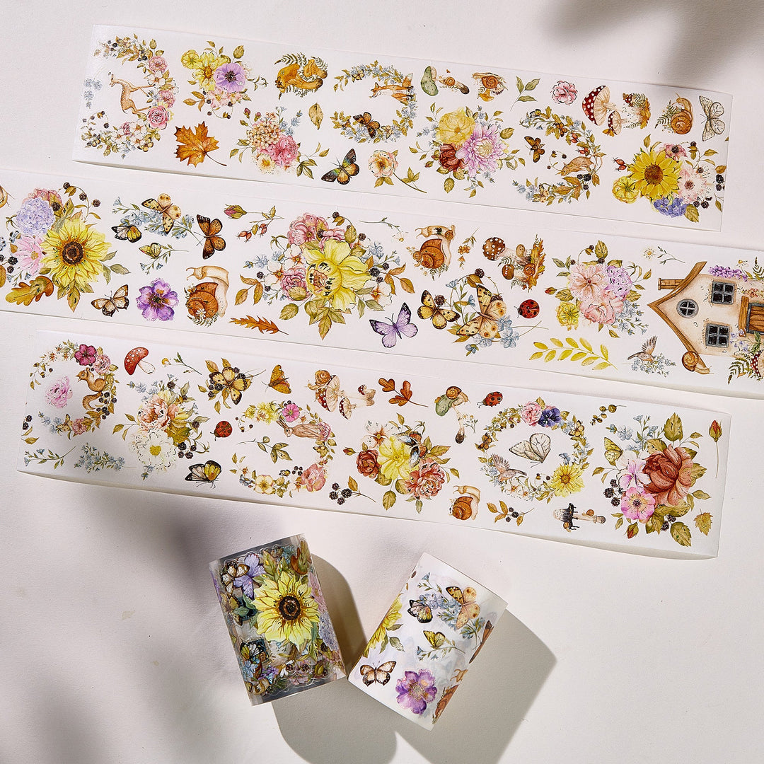 Strips of The Washi Tape Shop Golden Harvest Wide Washi/PET Tape beside the washi and PET rolls